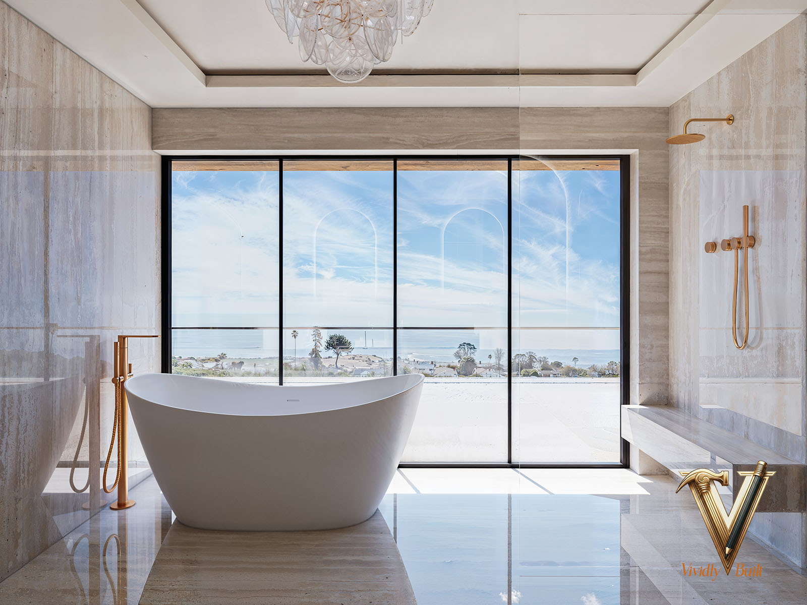 Primary bathroom in book-matched stone with a freestanding tub and a wet room - Palos Verdes estate by Vividly Built